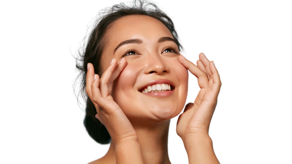a woman smiling touching her face